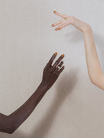 Hands wearing J. Hannah nail polish in Fauna