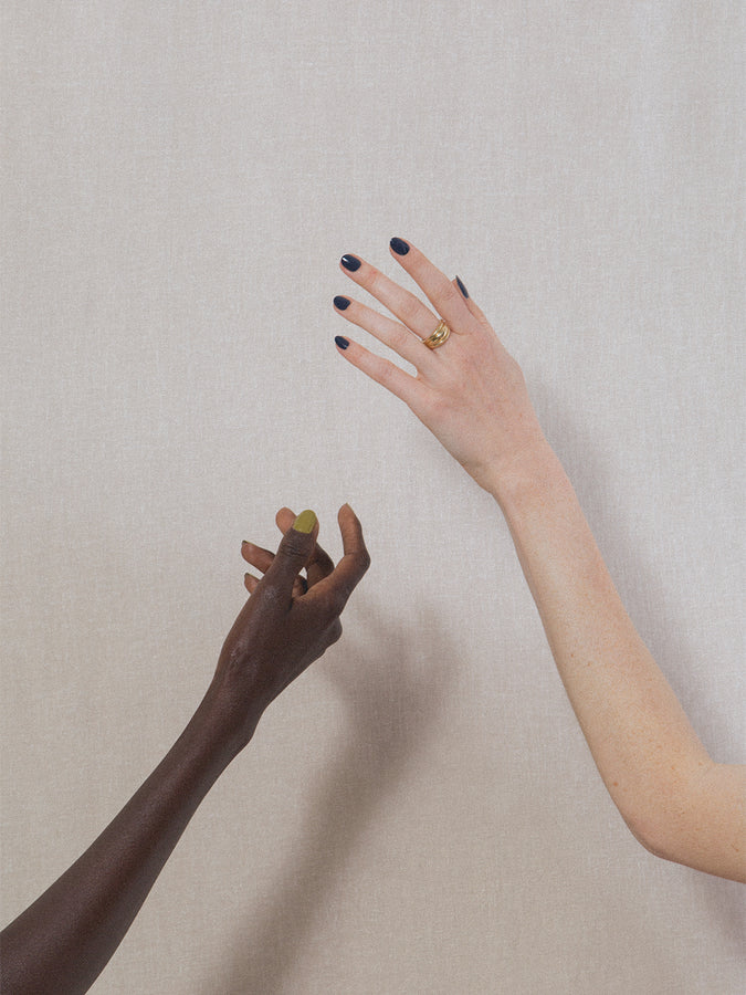 Two hands wearing J. Hannah nail polish in Blue Nudes.