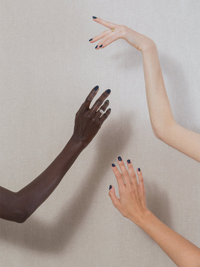 Three different hands wearing J. Hannah Nail Polish Blue Nudes.