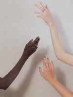 Hands wearing J. Hannah nail polish in Relic