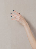 Left hand wearing J. Hannah Nail Polish in Blue Nudes.